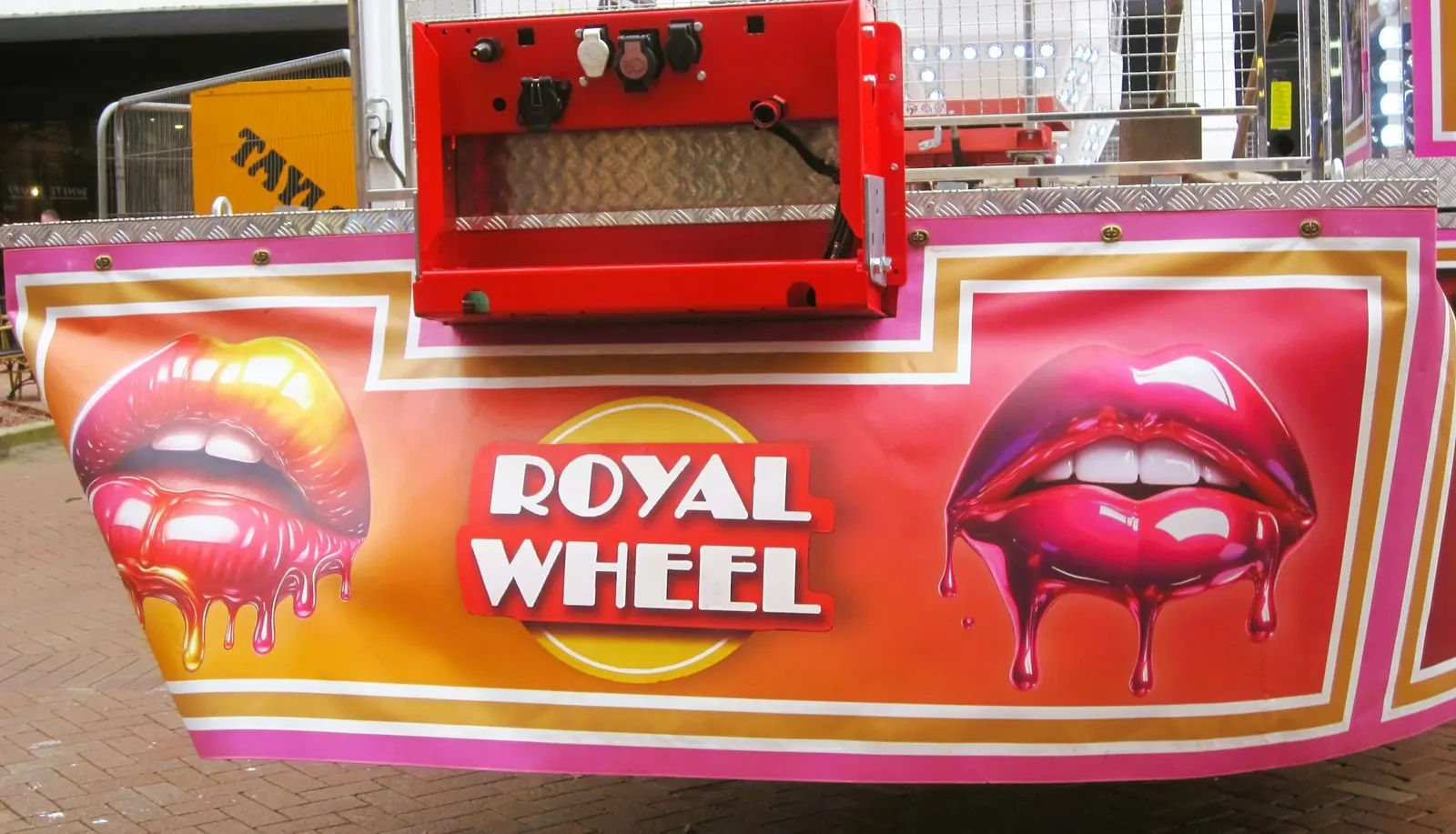 A red Royal Wheel sign with painted lips